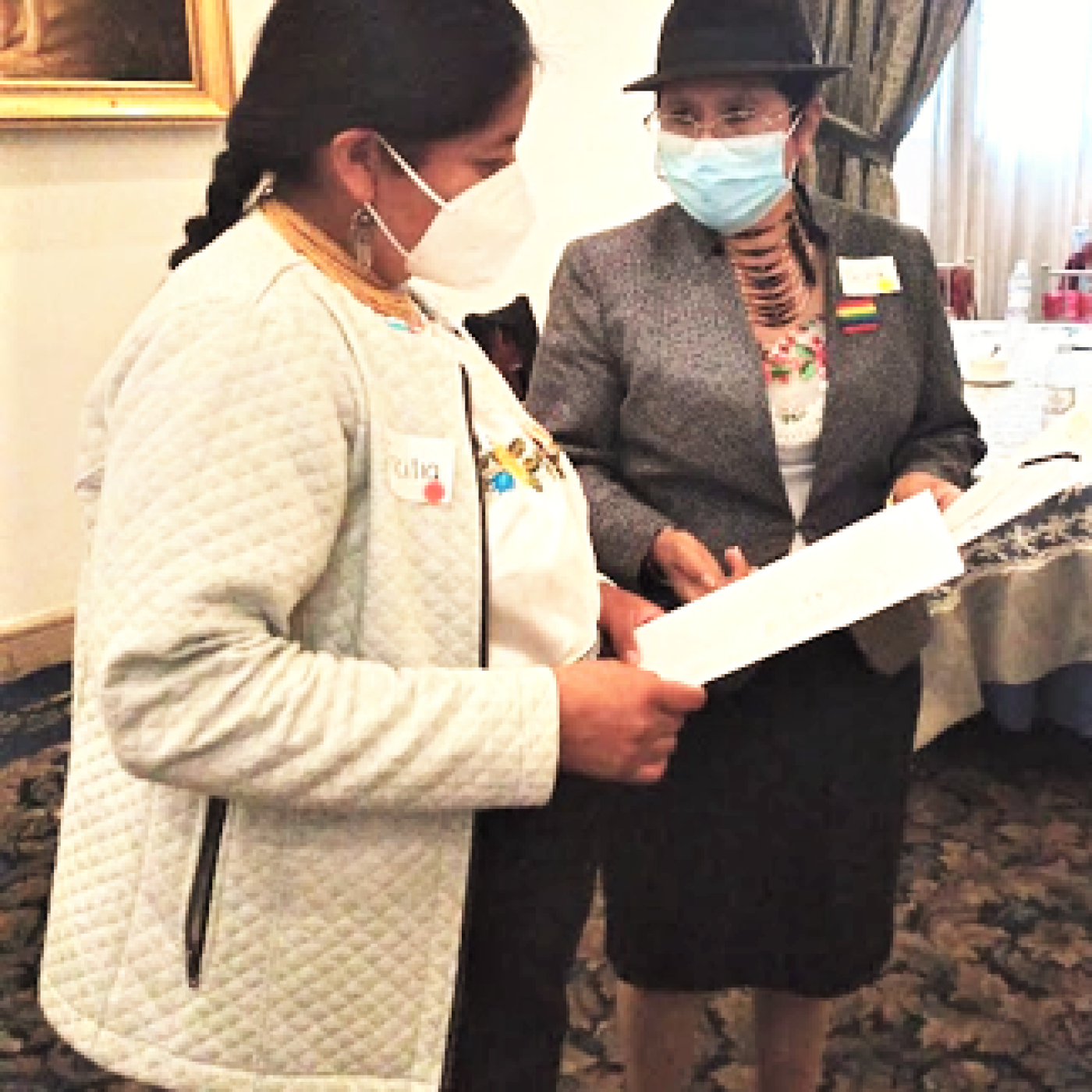 During a facilitated activity, two participants share ideas about what it means to be a leader as a woman in Quito, Ecuador